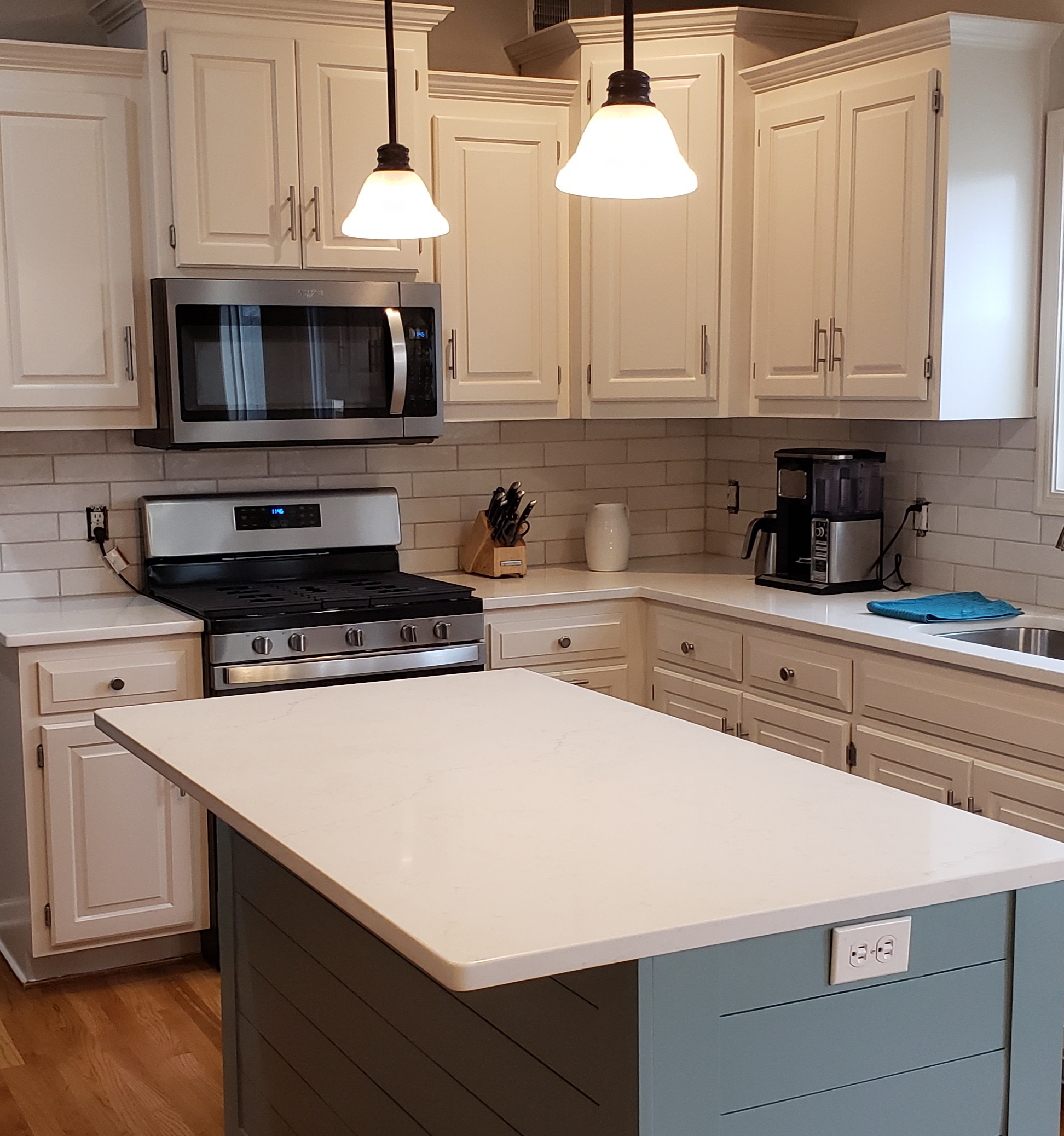 This Lee's Summit Mo kitchen makeover included shiplap on the island 