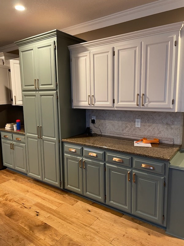 This Olathe Ks kitchen has two toned cabinets